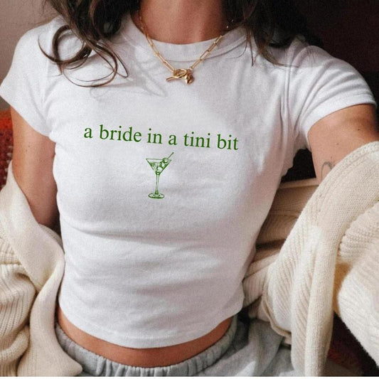 A Bride In A Tini Bit Baby Tee Dirty Martini Themed Bachelorette Party Dirty Martini Bride Baby Tee Dirty Martini Bachelorette Martini Bach