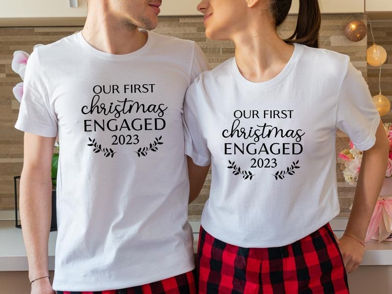 Our First Christmas Engaged 2023 Shirt, Matching New Engaged Couple Xmas T-Shirt, Engagement Gift Holiday Tee, Fiancé And Fiancée Christmas Outfit.
