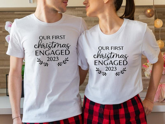 Our First Christmas Engaged 2023 Shirt, Matching New Engaged Couple Xmas T-Shirt, Engagement Gift Holiday Tee, Fiancé And Fiancée Christmas Outfit.
